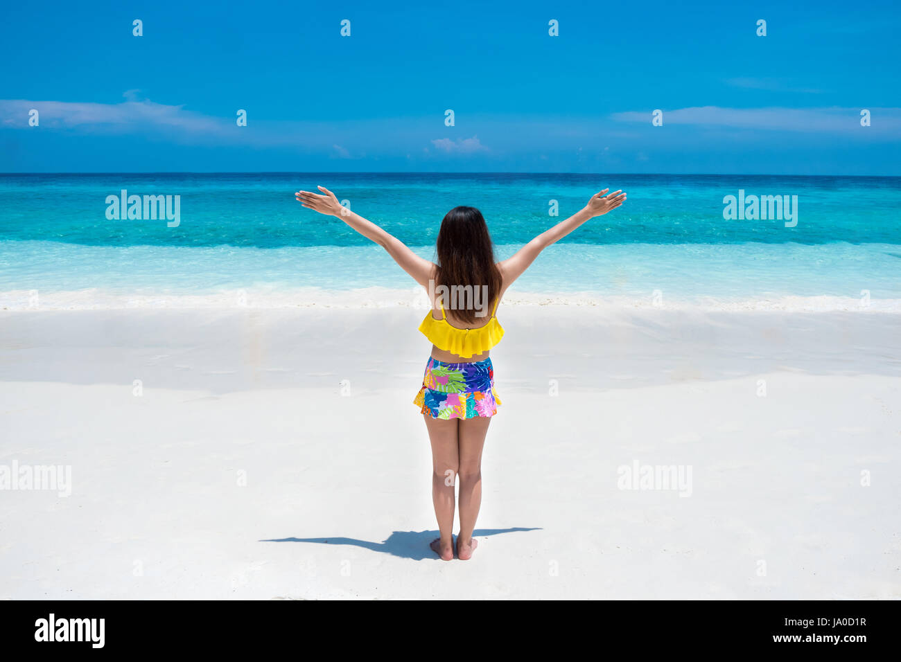 Beautiful Bikini Woman Stand And Enjoying Tropical Beach Nature With White Sand And Blue Sea At