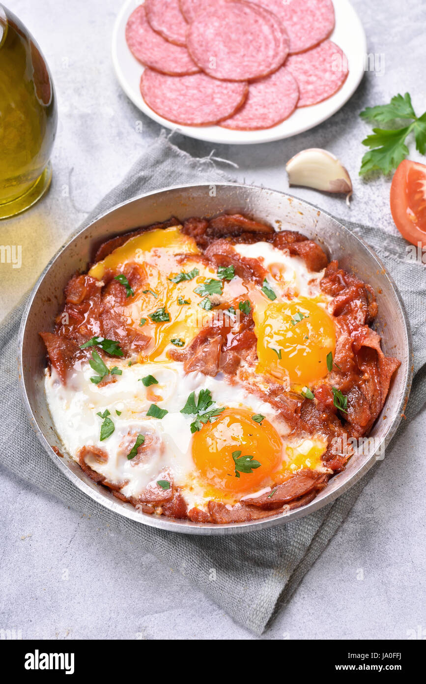 Breakfast with fried eggs and bacon in frying pan Stock Photo Alamy