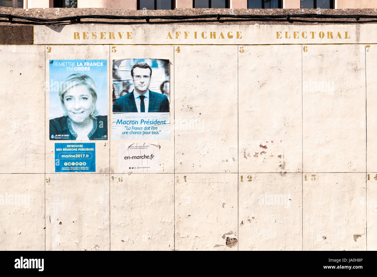 French 2017 presidential election posters for Marine Le Pen and Emmanuel Macron in a small village in south of France. Stock Photo