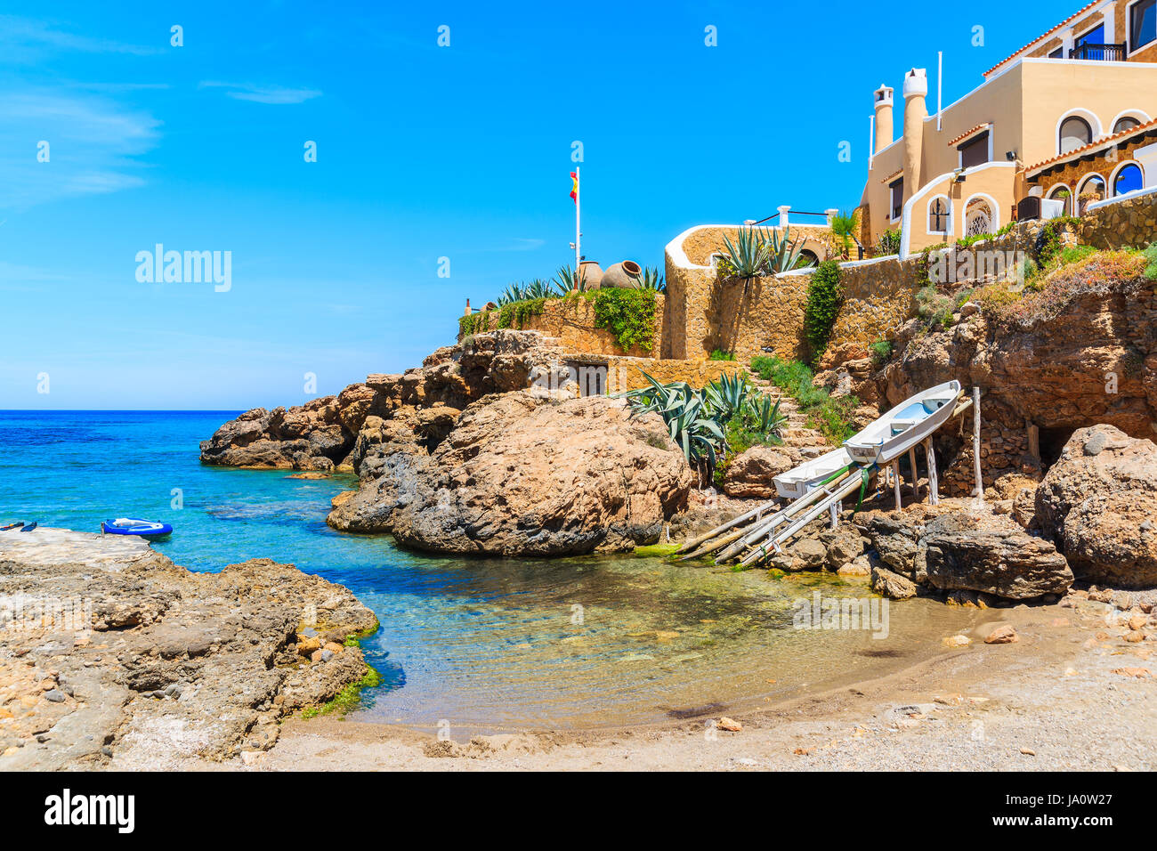 Small bay among rocks in Cala Xarraca bay, Ibiza island, Spain Stock Photo