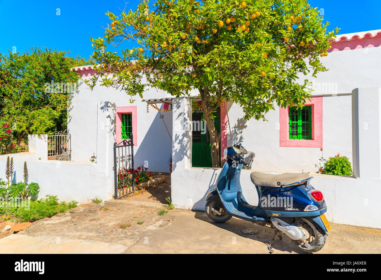 ISLAND, SPAIN MAY 18, 2017 classic Vespa scooter parking under