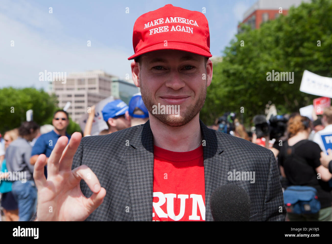Washington, DC USA, 3rd June, 2017: Trump supporters gather in front of the White House to show approval of the president's decision to exit Paris Climate Accord - Photo: Trump supporter making OK sign. Credit: B Christopher/Alamy Live News Stock Photo