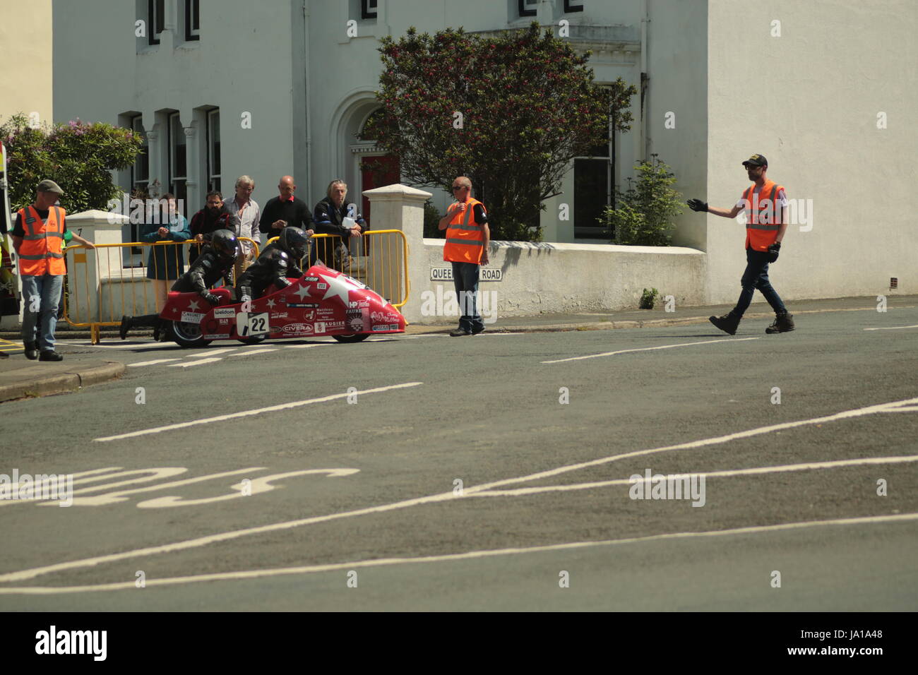 Isle of Man TT Races, Qualifying Practice Race, Saturday 3 June 2017.Sidecar Qualifying session. Marshals help Estelle Leblonde and Melanie Farnier of the Racingside team from Pigeon, France move their 600cc SGR Suzuki sidecar (number 22) off the course into a side road . The riders make a quick roadside repair then are allowed to continue on towards the Mountain Road. (Photo series) Credit: Eclectic Art and Photography/Alamy Live News Stock Photo