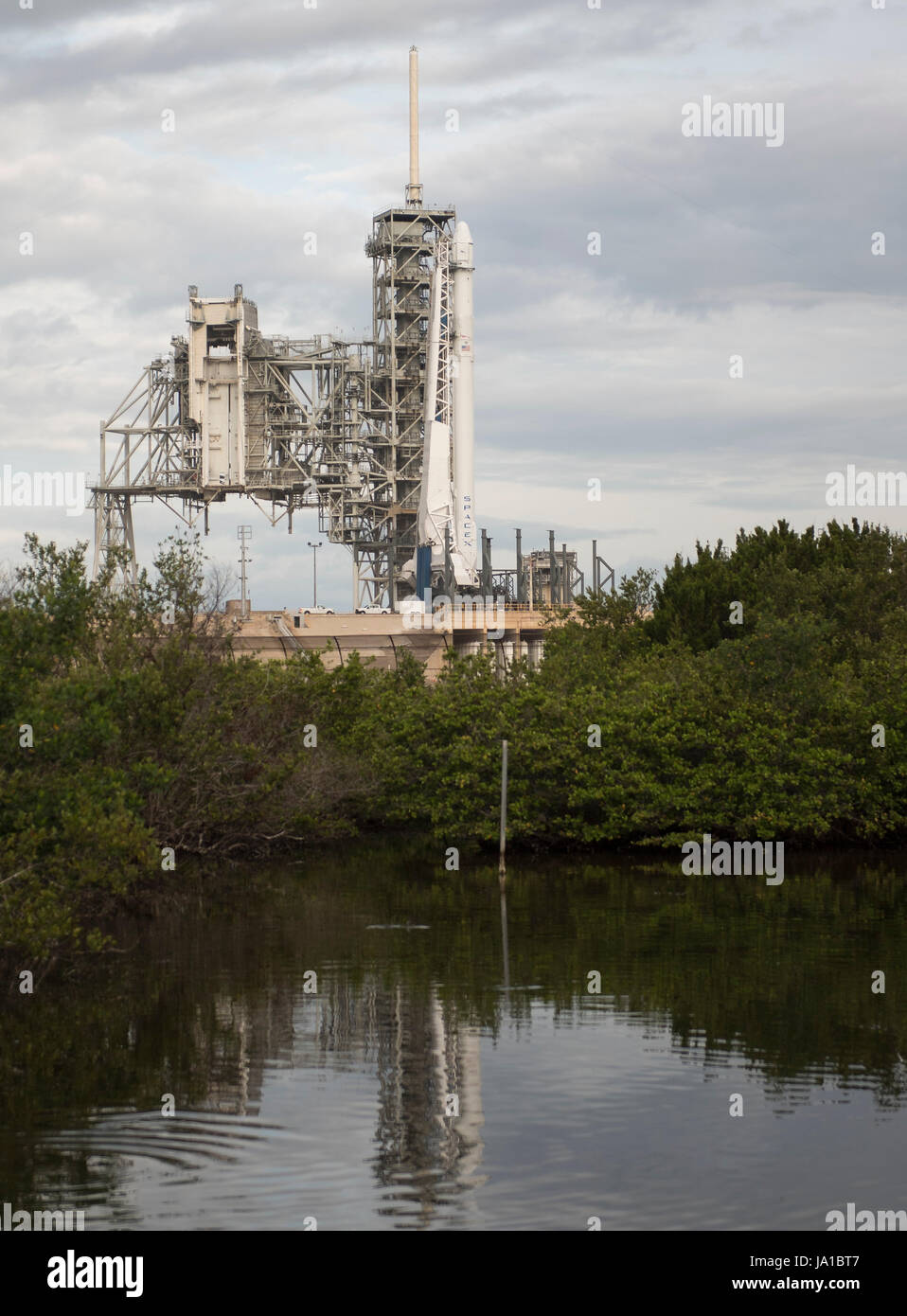 Cape Canaveral, Florida, USA. 03rd June, 2017. The SpaceX Falcon 9 rocket, with the Dragon spacecraft onboard, is seen at Launch Complex 39A at NASA's Kennedy Space Center in Cape Canaveral, Florida, Saturday, June 3, 2017. Dragon is carrying almost 6,000 pounds of science research, crew supplies and hardware to the International Space Station in support of the Expedition 52 and 53 crew members. The unpressurized trunk of the spacecraft also will transport solar panels, tools for Earth-observation and equipment to study neutron stars. Stock Photo