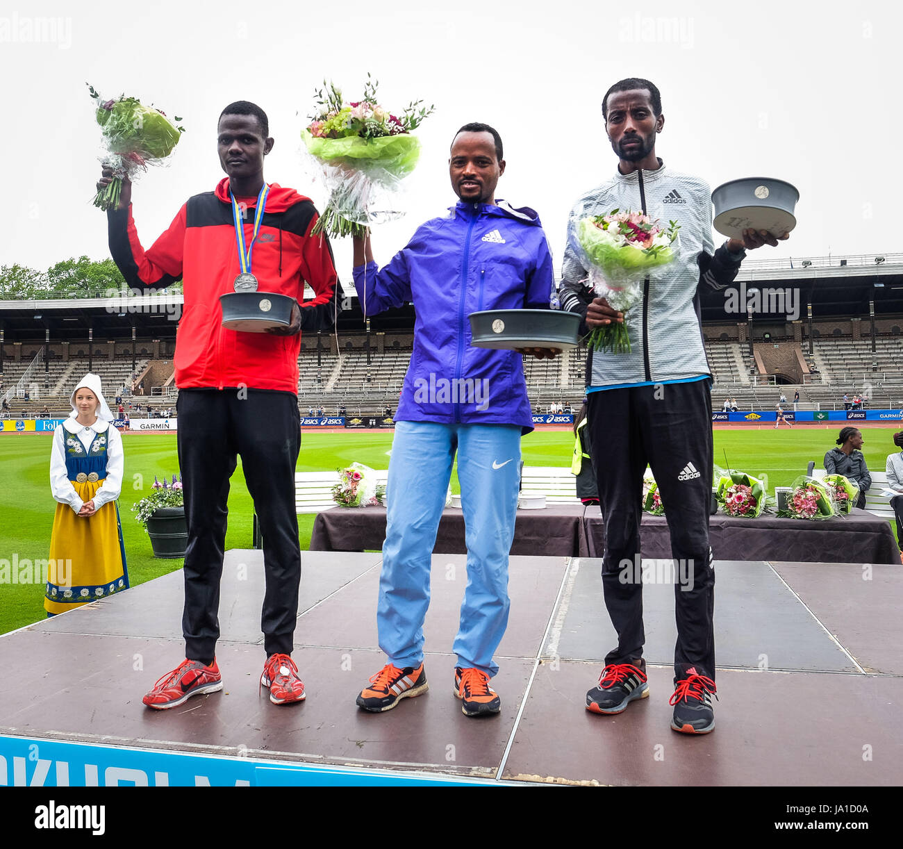 Stockholm. 3rd June, 2017. Abrha Milaw (C) of Ethiopia celebrates during  the awarding ceremony for the Stockholm Marathon 2017 in Stockholm, capital  of Sweden on June 3, 2017. Milaw won with a