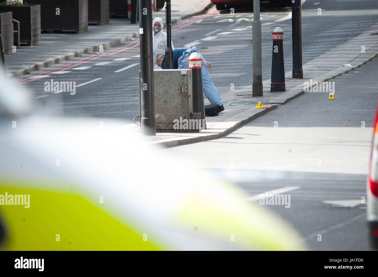 London England. 4th June 2017. Police forensic officers work on London Bridge Bridge. London Attack: seven killed; three terror suspects shot dead by police. ©Michael Tubi/Alamy Live News Stock Photo