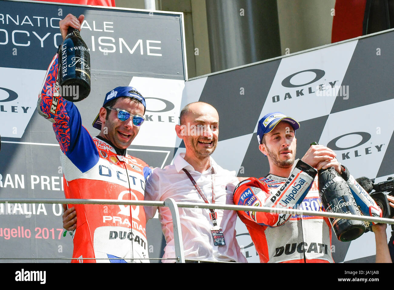 Florence, Italy. 04th June, 2017. SCARPERIA, FLORENCE, ITALY - JUNE 04:, 2017 Andrea Dovizioso (R) of Italy and Ducati Team, Claudio Domenicali (C) of Italy Ducati engineer and Danilo Petrucci (L) of Italy and OCTO Pramac Racing celebrates on the podium at the end race MotoGP during MotoGP Gran Premio d'Italia- at Mugello Circuit. on june 04, 2017 in Scarperia Italy. (Photo by Marco Iorio) Credit: marco iorio/Alamy Live News Stock Photo