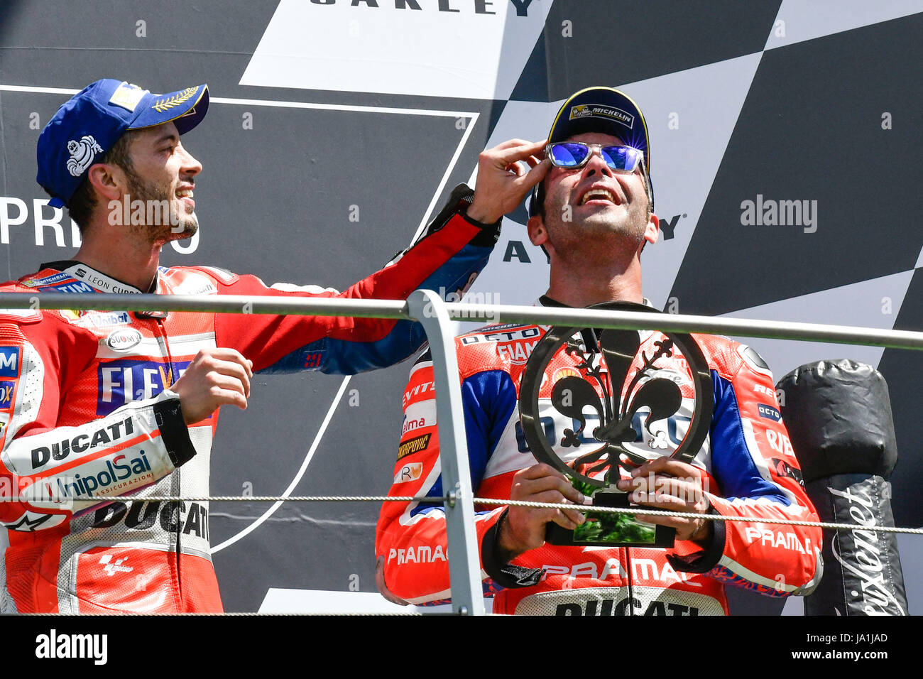 Florence, Italy. 04th June, 2017. SCARPERIA, FLORENCE, ITALY - JUNE 04:, 2017 Andrea Dovizioso (L) of Italy and Ducati Team, and Danilo Petrucci (R) of Italy and OCTO Pramac Racing celebrates on the podium at the end race MotoGP during MotoGP Gran Premio d'Italia- at Mugello Circuit. on june 04, 2017 in Scarperia Italy. (Photo by Marco Iorio) Credit: marco iorio/Alamy Live News Stock Photo