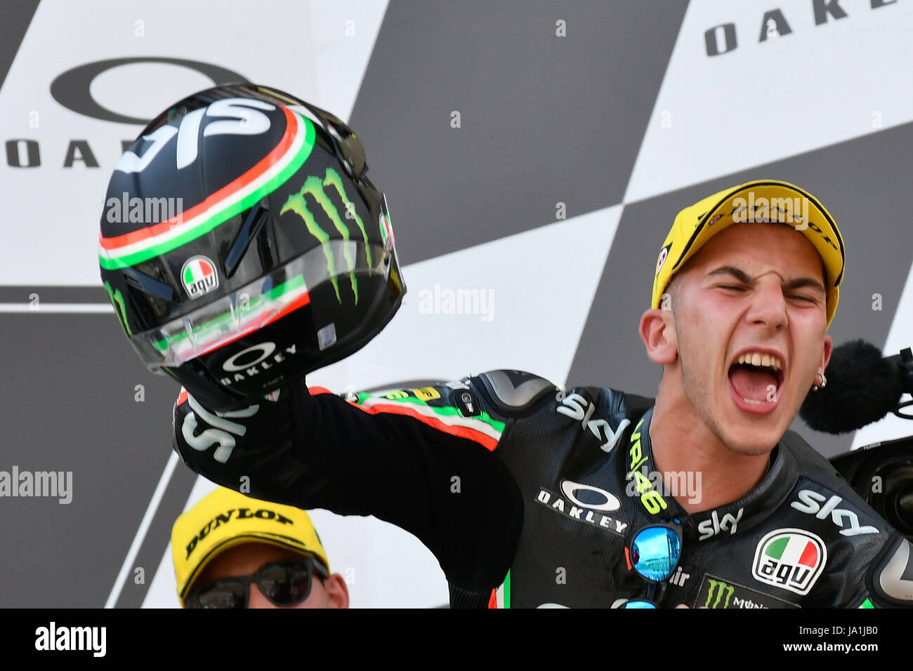 Florence, Italy. 04th June, 2017. SCARPERIA, FLORENCE, ITALY - JUNE 04:, 2017 Andrea Migno of Italy and SKY Racing Team VR46 celebrates his victory on the podium at the end the race Moto3 during MotoGP Gran Premio d'Italia- at Mugello Circuit. on june 04, 2017 in Scarperia Italy. (Photo by Marco Iorio) Credit: marco iorio/Alamy Live News Stock Photo