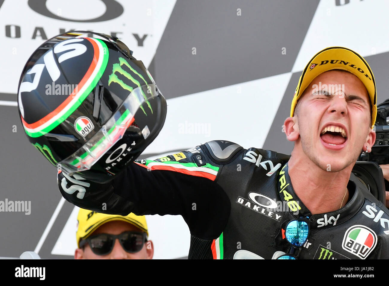 Florence, Italy. 04th June, 2017. SCARPERIA, FLORENCE, ITALY - JUNE 04:, 2017 Andrea Migno of Italy and SKY Racing Team VR46 celebrates his victory on the podium at the end the race Moto3 during MotoGP Gran Premio d'Italia- at Mugello Circuit. on june 04, 2017 in Scarperia Italy. (Photo by Marco Iorio) Credit: marco iorio/Alamy Live News Stock Photo
