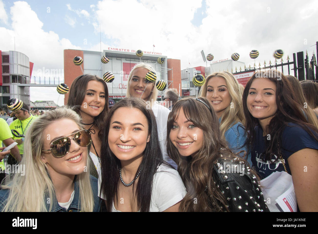 Manchester, UK. 4th June, 2017. Young Manchester fans wearing the Manchester Bee headsets wait to enter the One love concert at the Emirates Old Trafford stadium. Manchester Picture Credit: GARY ROBERTS/Alamy Live News Stock Photo