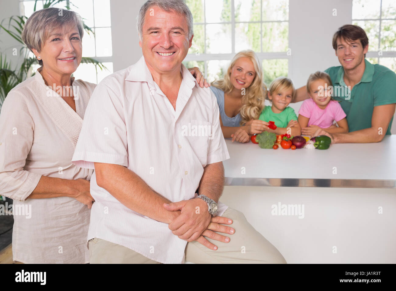 Portrait of grandparents with their family on background Stock Photo