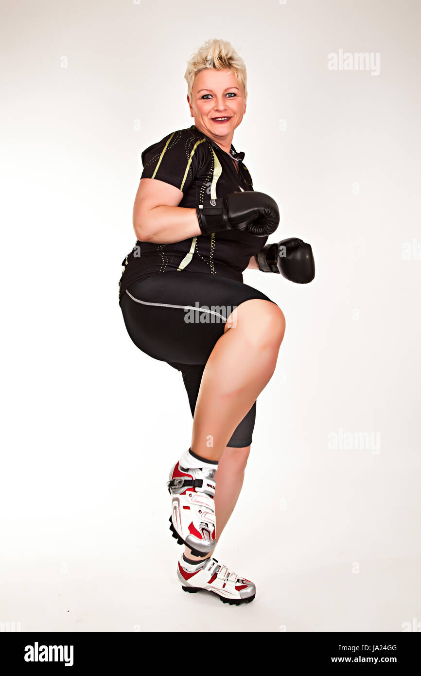 middelaged fitness woman boxing wearing boxing gloves and having fun Stock Photo