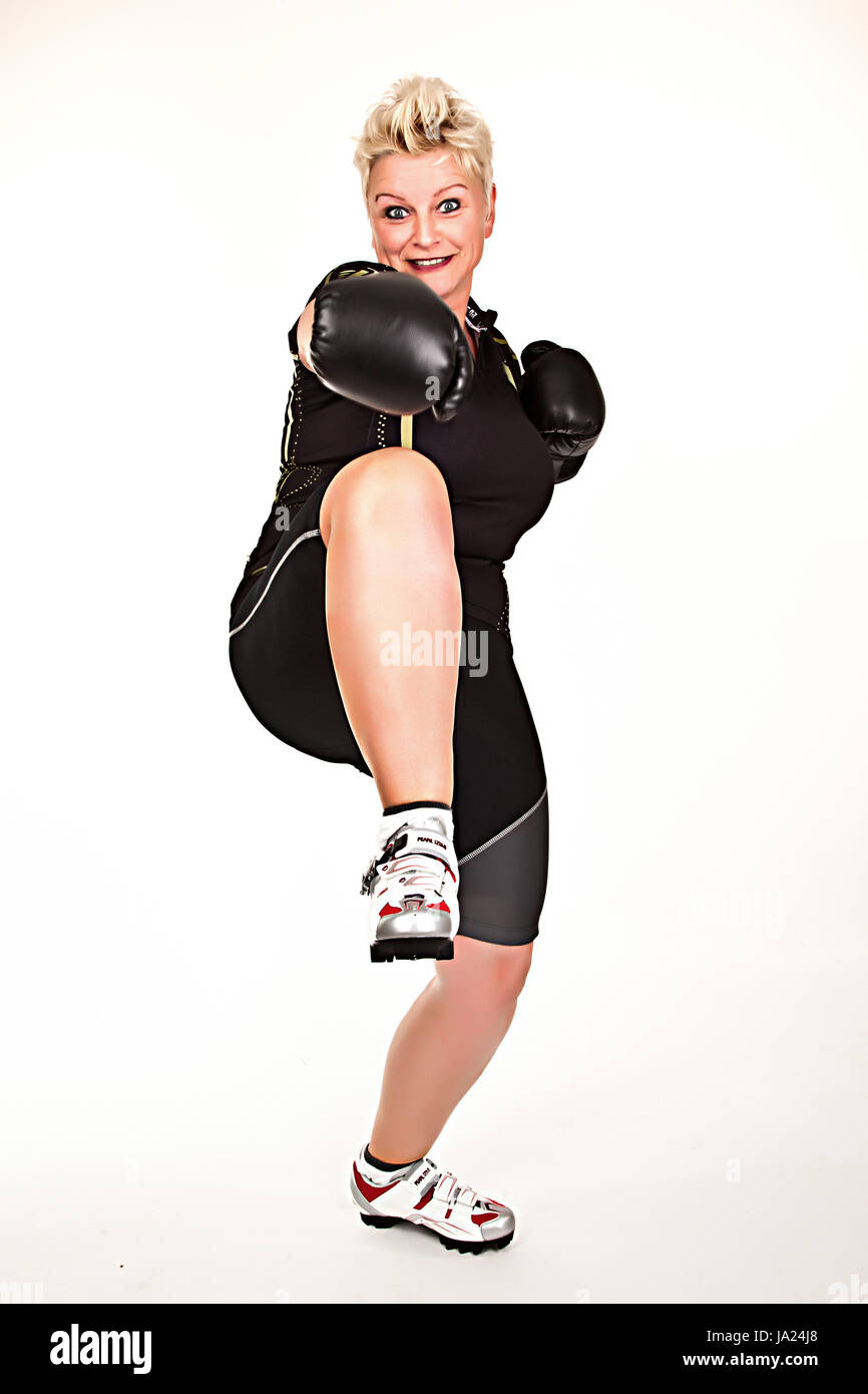 middelaged fitness woman boxing wearing boxing gloves and having fun Stock Photo