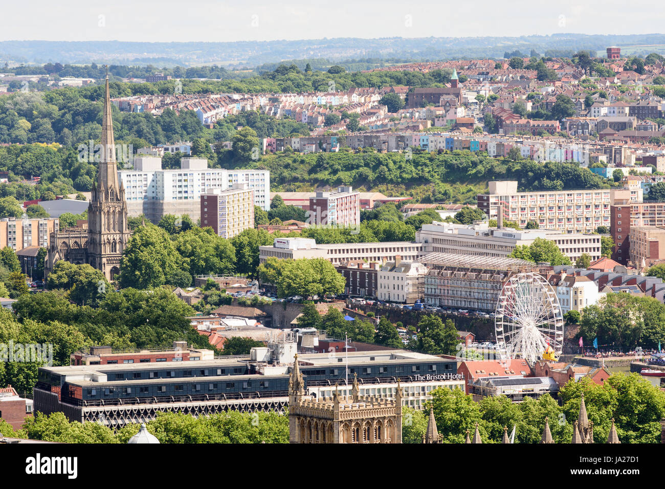 Bristol, England - July 17, 2016: The tall spire of St Mary Redcliffe church and council housing blocks of the Redcliffe Estate stand prominent in the Stock Photo