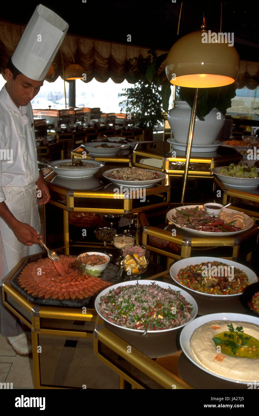 A traditional Middle Eastern buffet with various dips including