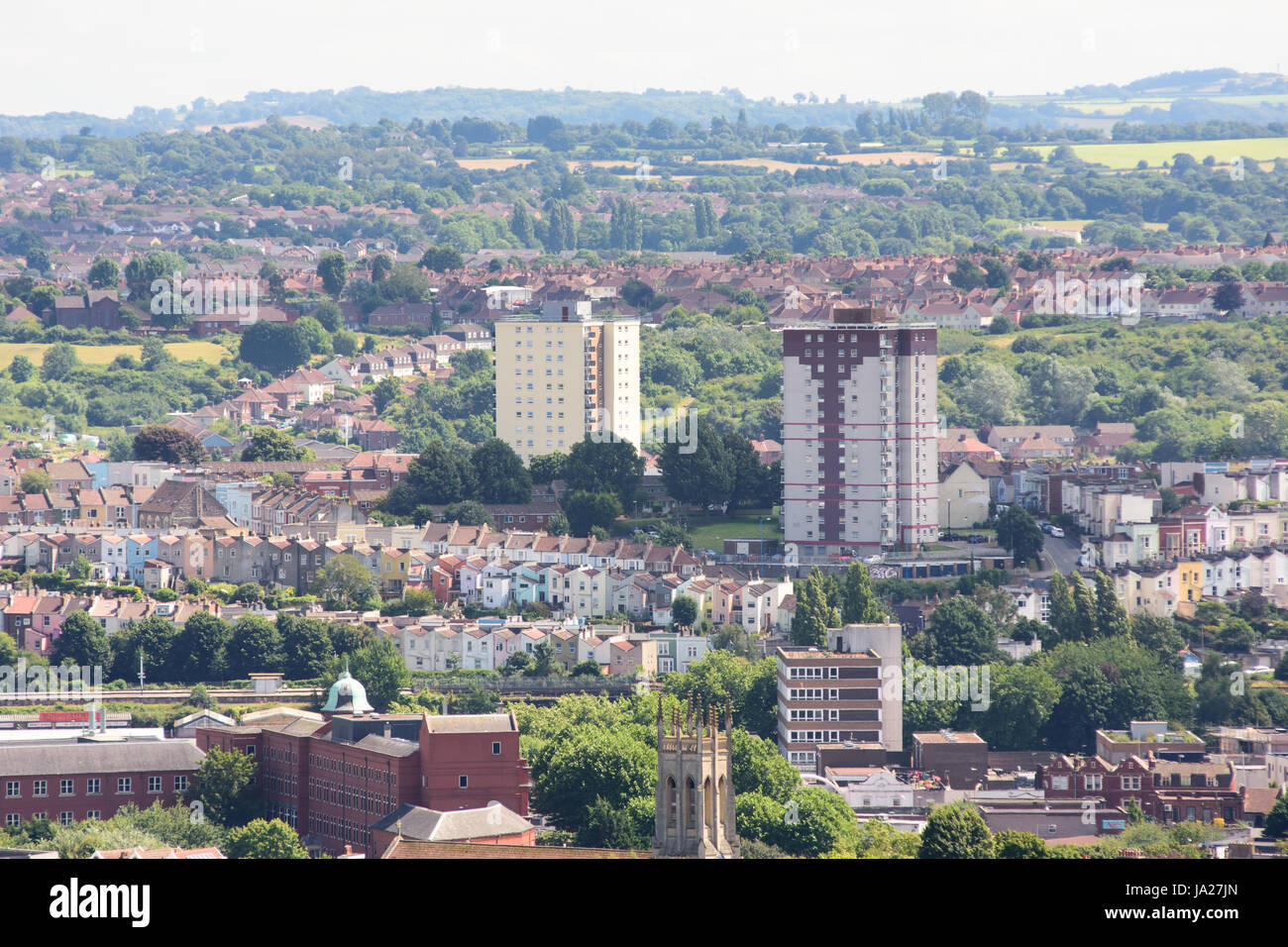 Bristol, England, UK July 17, 2016 Council estate tower blocks rise above the terraced