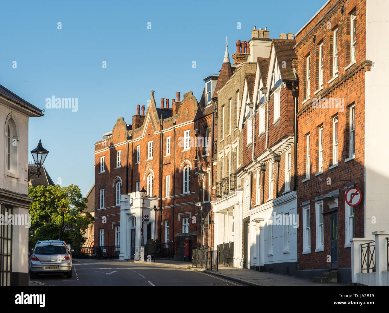 London, England - August 6, 2016: Traditional buildings line the High Street at Harrow-On-The-Hill in West London. Stock Photo