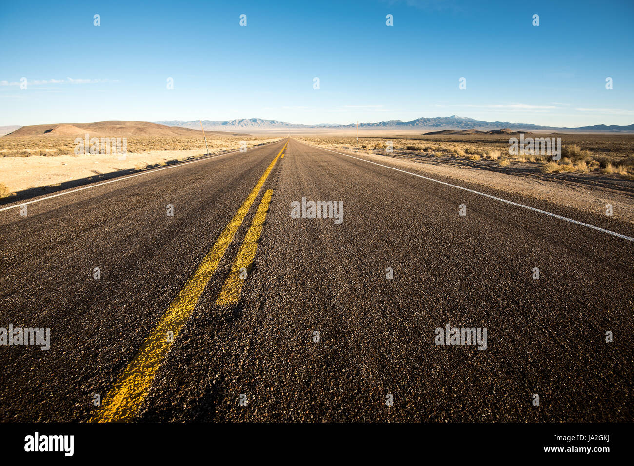 State Highway 375, known as the 'Extraterrestrial Highway', crosses a lonely expanse of the Nevada desert near Area 51. Stock Photo