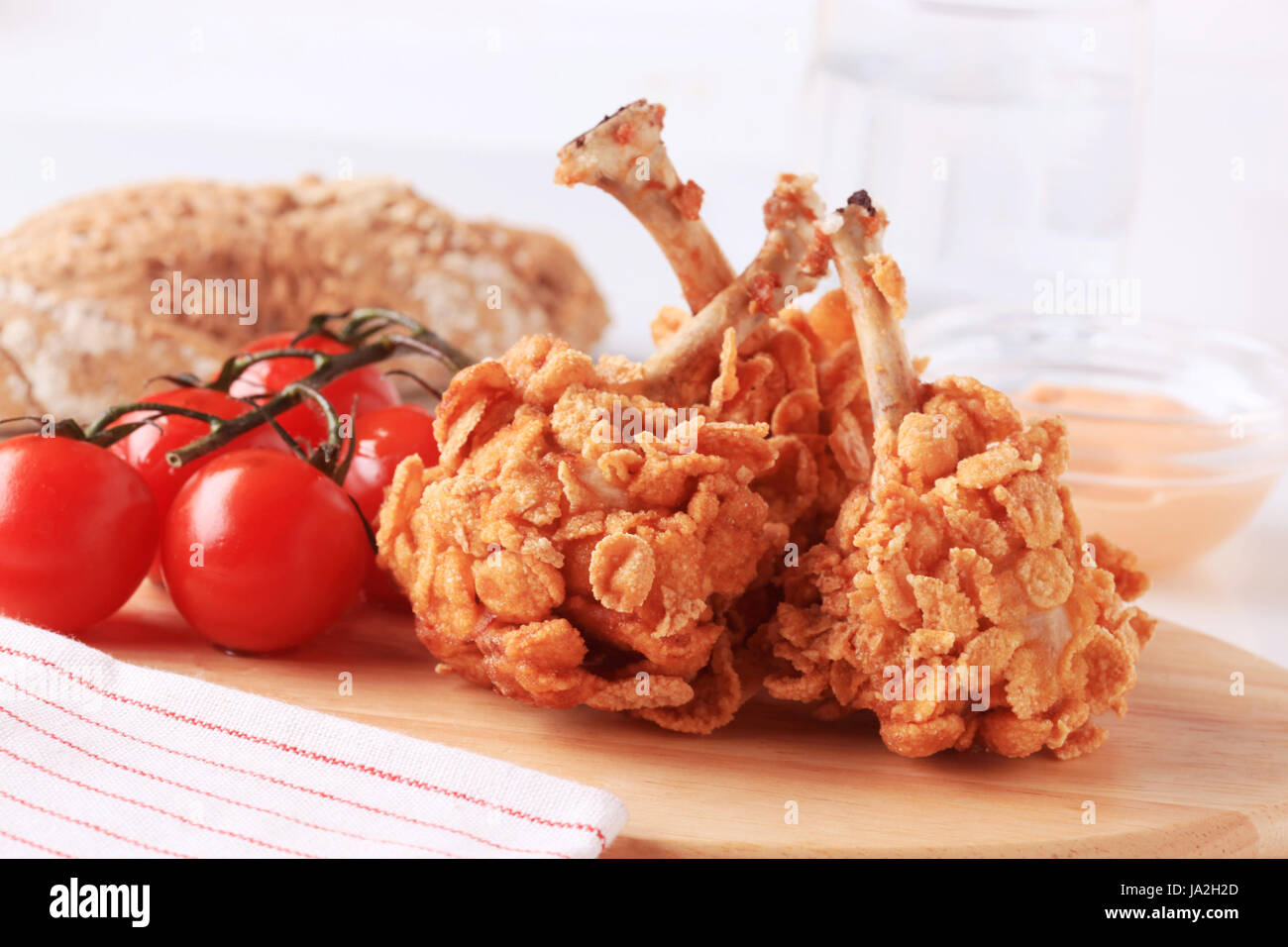 Chicken drumsticks coated with corn flakes closeup Stock Photo Alamy