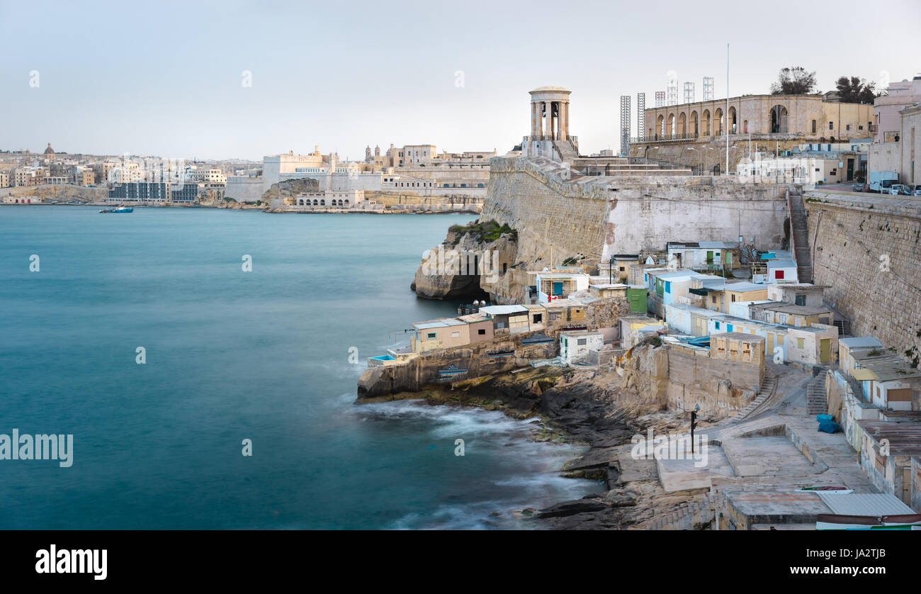 Valletta, Malta. The Grand Harbour view with Valletta seafront, Siege Bell memorial and Lower Barrakka Gardens Stock Photo