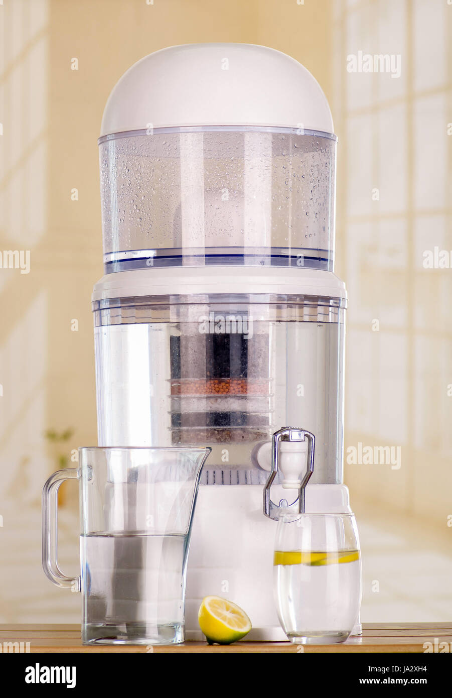 Filter system of water purifier on a kitchen background Stock Photo