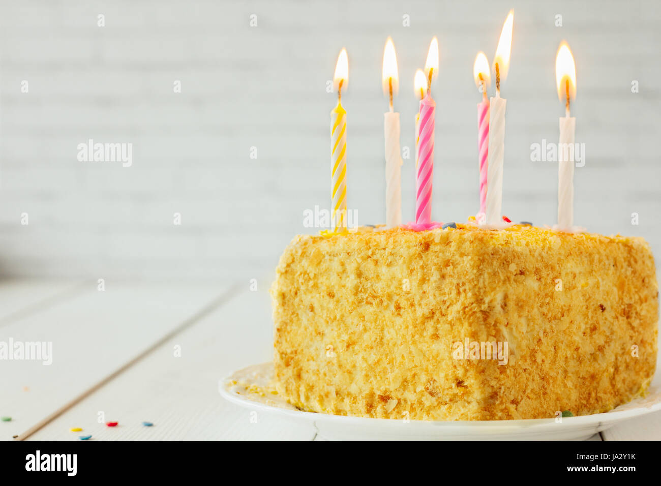 Birthday cake with candles on wooden table selective focus Stock Photo ...
