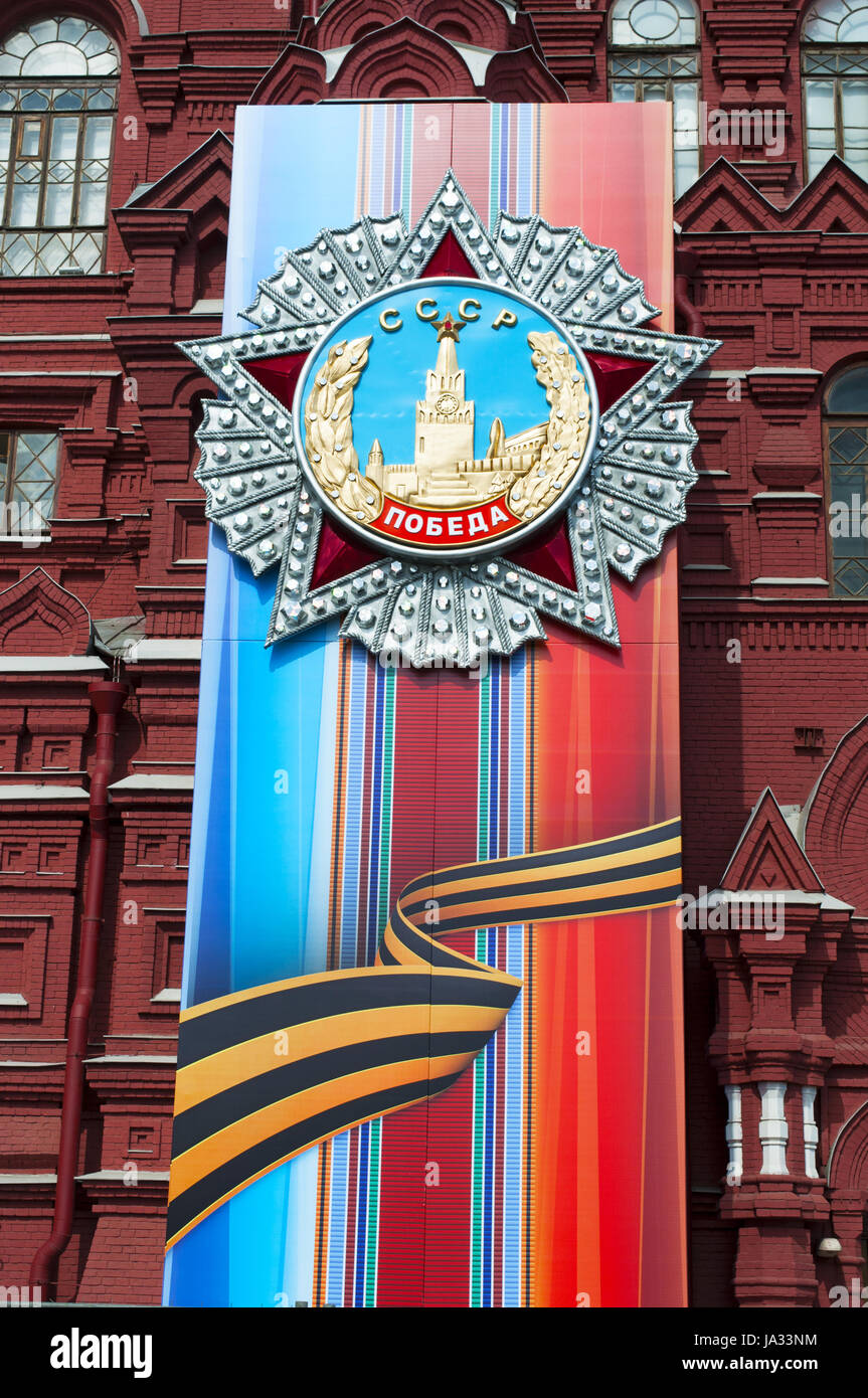 the decorations for the 1st May parade on the facade of the State Historical Museum, the Russian history museum in a iconic 19th century red building Stock Photo
