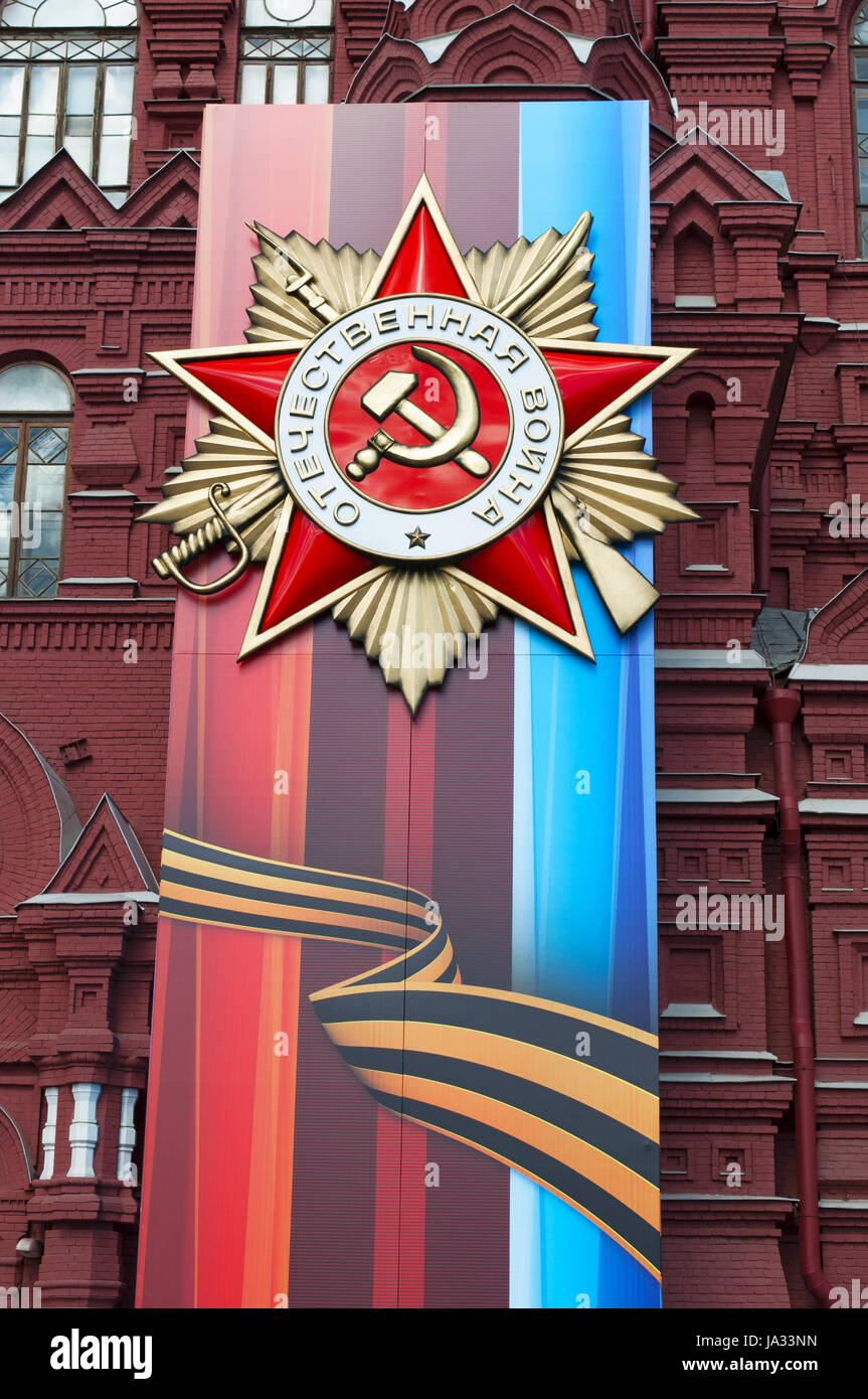 the decorations for the 1st May parade on the facade of the State Historical Museum, the Russian history museum in a iconic 19th century red building Stock Photo