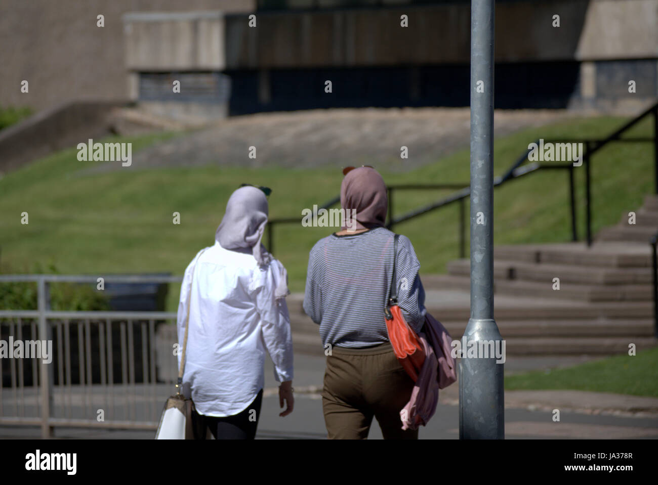 hijab scarf wearing Muslim on British street Stock Photo