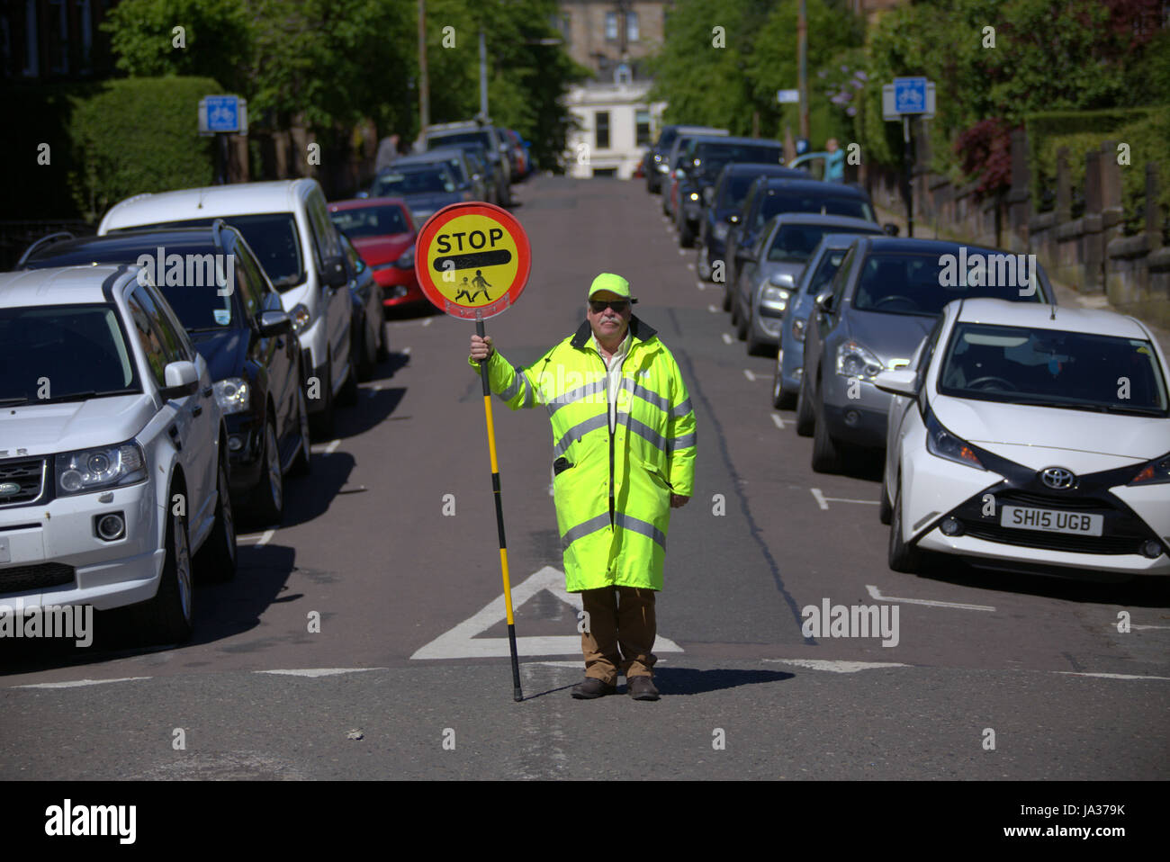 lollipop man road west end Glasgow school crossing Stock Photo