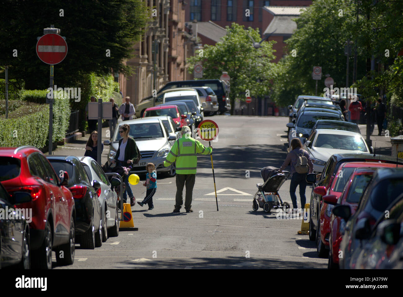 lollipop man road west end Glasgow school crossing Stock Photo