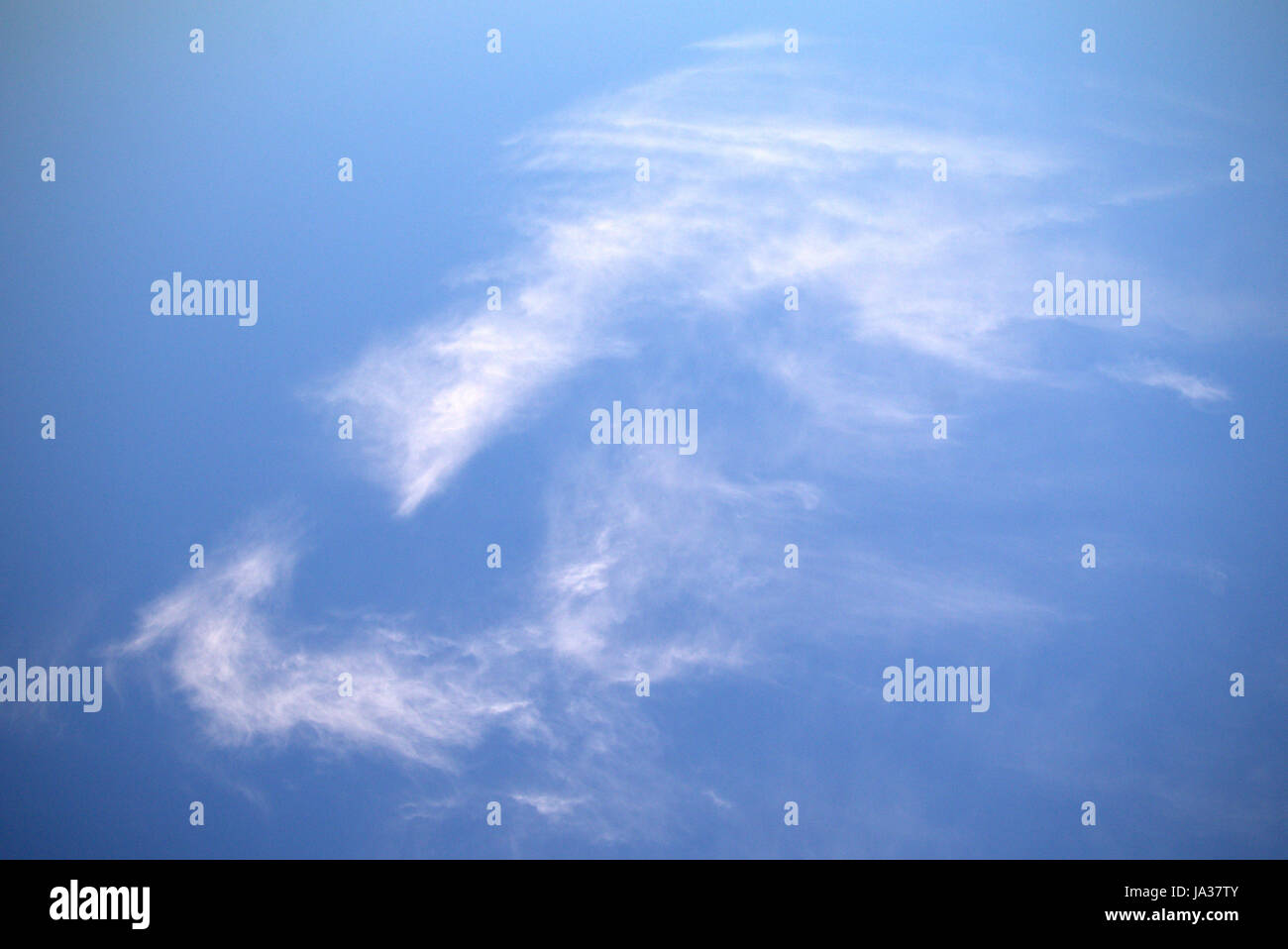 blue sky cirrus clouds white mans face or mask  natural not Photoshop Stock Photo