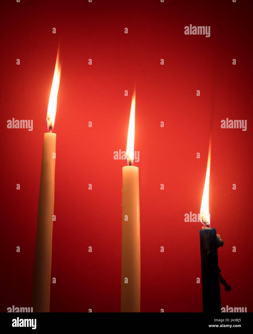 Holy religious candles burning creating a mysterious atmosphere Stock Photo Alamy
