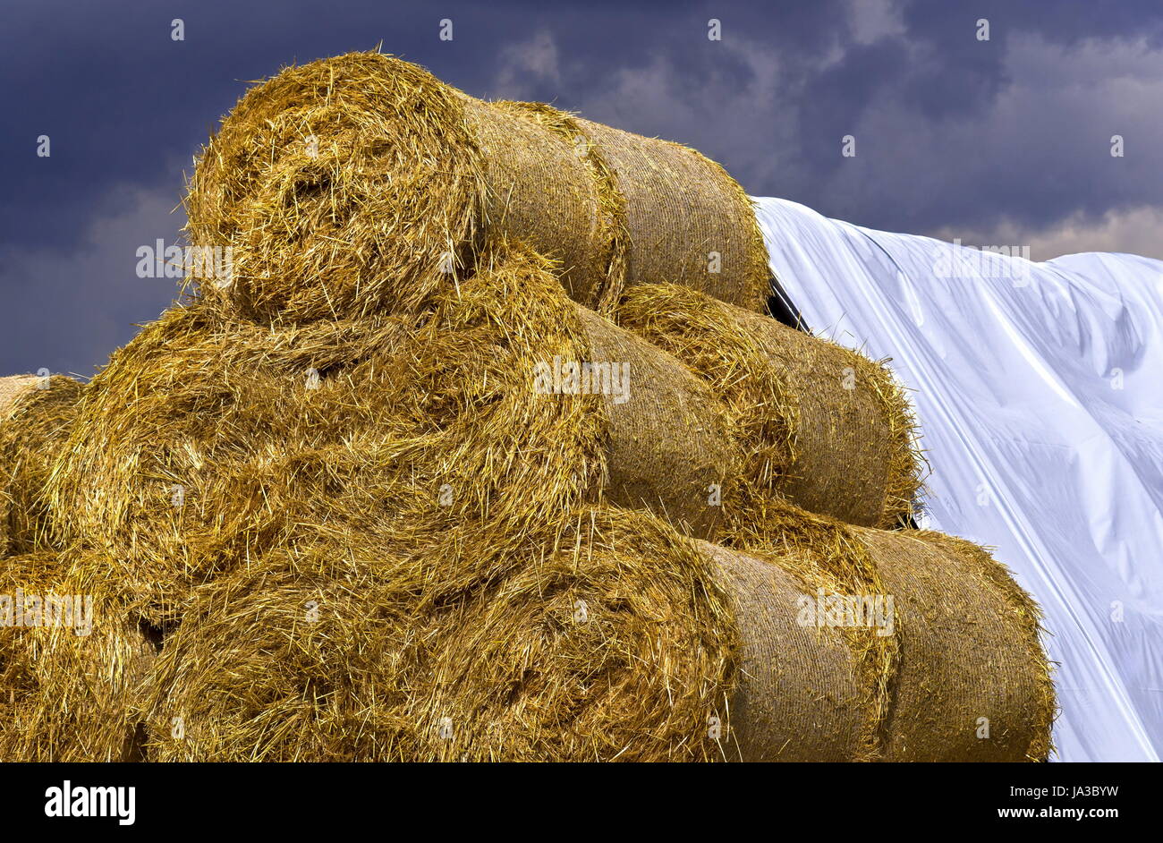 bale with tarp over each other Stock Photo