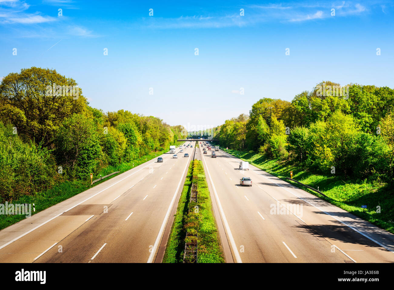 Highway traffic with cars and trucks on sunny spring day, Germany Stock Photo