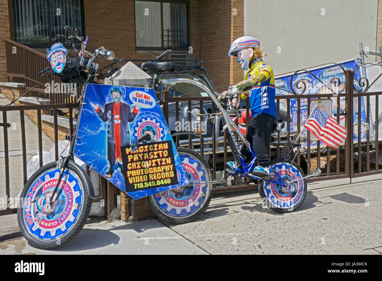 A decorated bicycle with advertisements for Payasito Chiquitin, a Latin American clown. In Astoria, Stock Photo A motorcycle with a sma Stock Photo