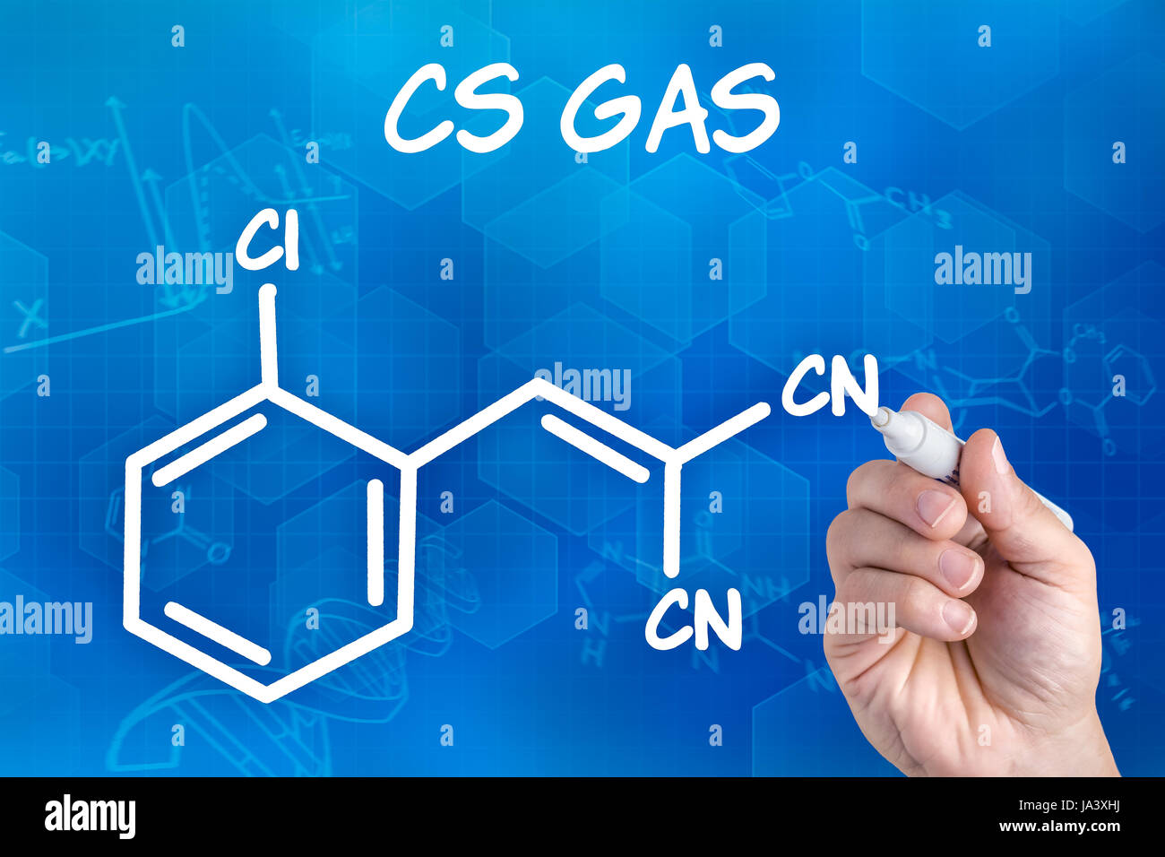 hand with pencil draws chemical structural formula of cs gas Stock Photo