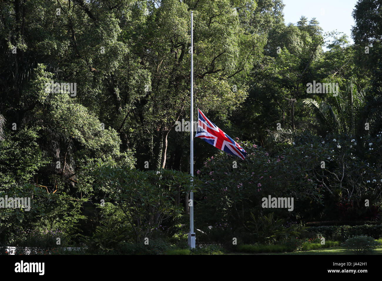The Union flag flies at half mast outside Eden Hall, the British High Commissioner's official residence in Singapore, following the London terror attack. Stock Photo