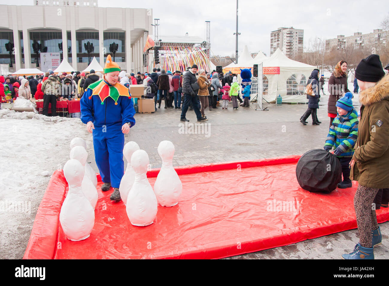 PERM, RUSSIA - March 13, 2016: Children playing skittles at the celebration of Carnival Stock Photo