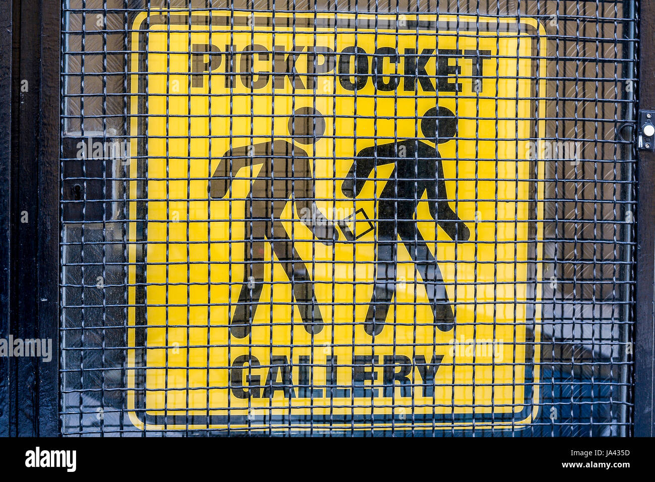 Pickpocket gallery - a warning sign black on yellow background Stock Photo