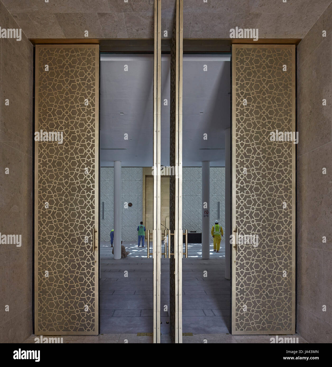 View in mosque through gold doors during prayers. Jumaa Mosque, Doha ...