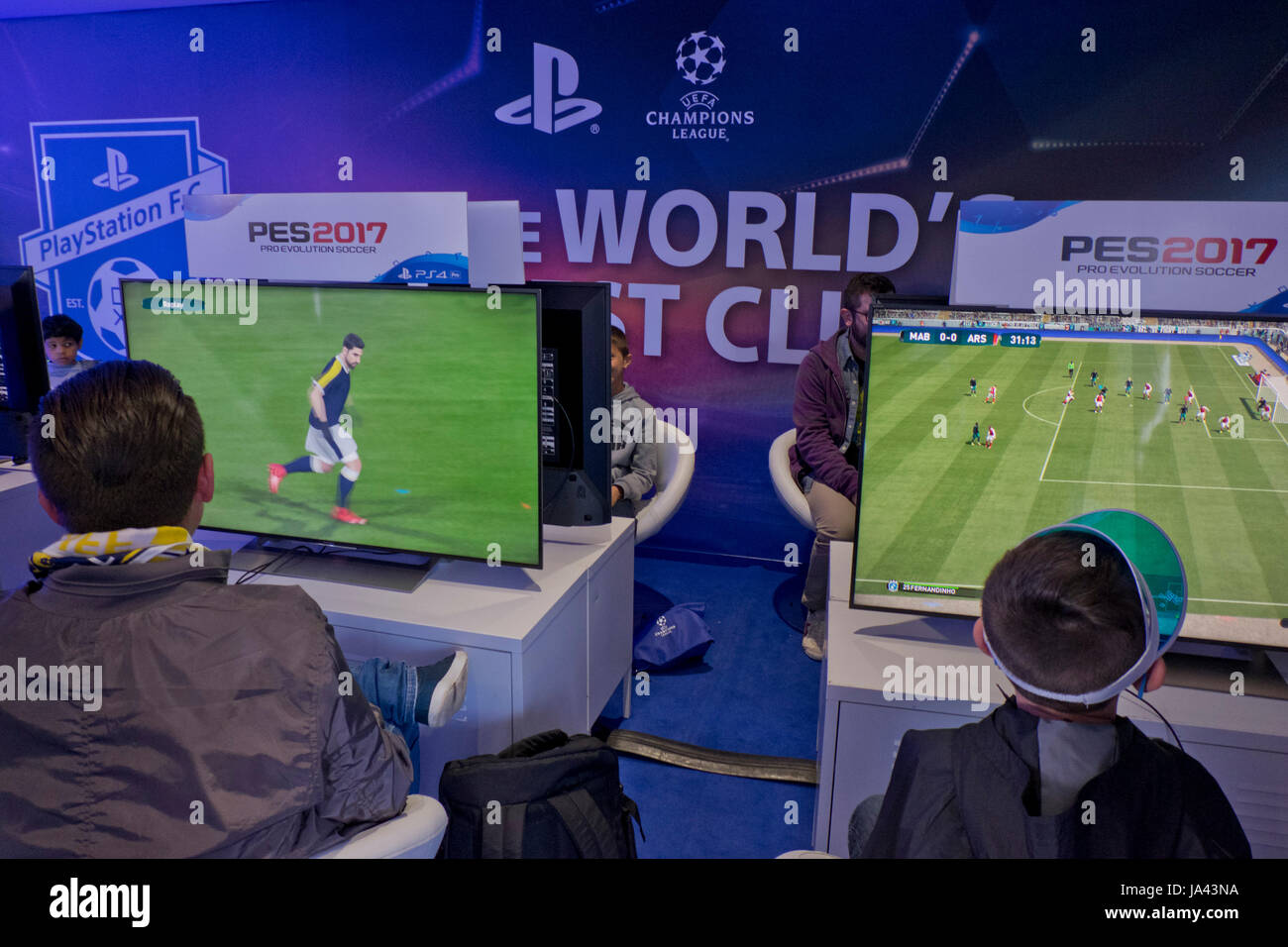 Young Real Madrid and Juventus fans trying latest Playstation football game  before the UEFA Champions League Final between Real Madrid and Juventus in  Cardiff,Wales,UK Stock Photo - Alamy
