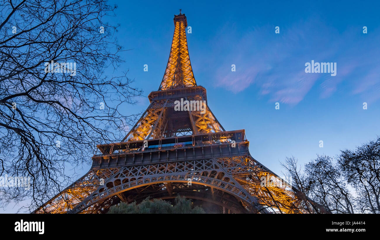 Close up tilt up timelapse view of the Eiffel tower in Paris at sunset Stock Photo