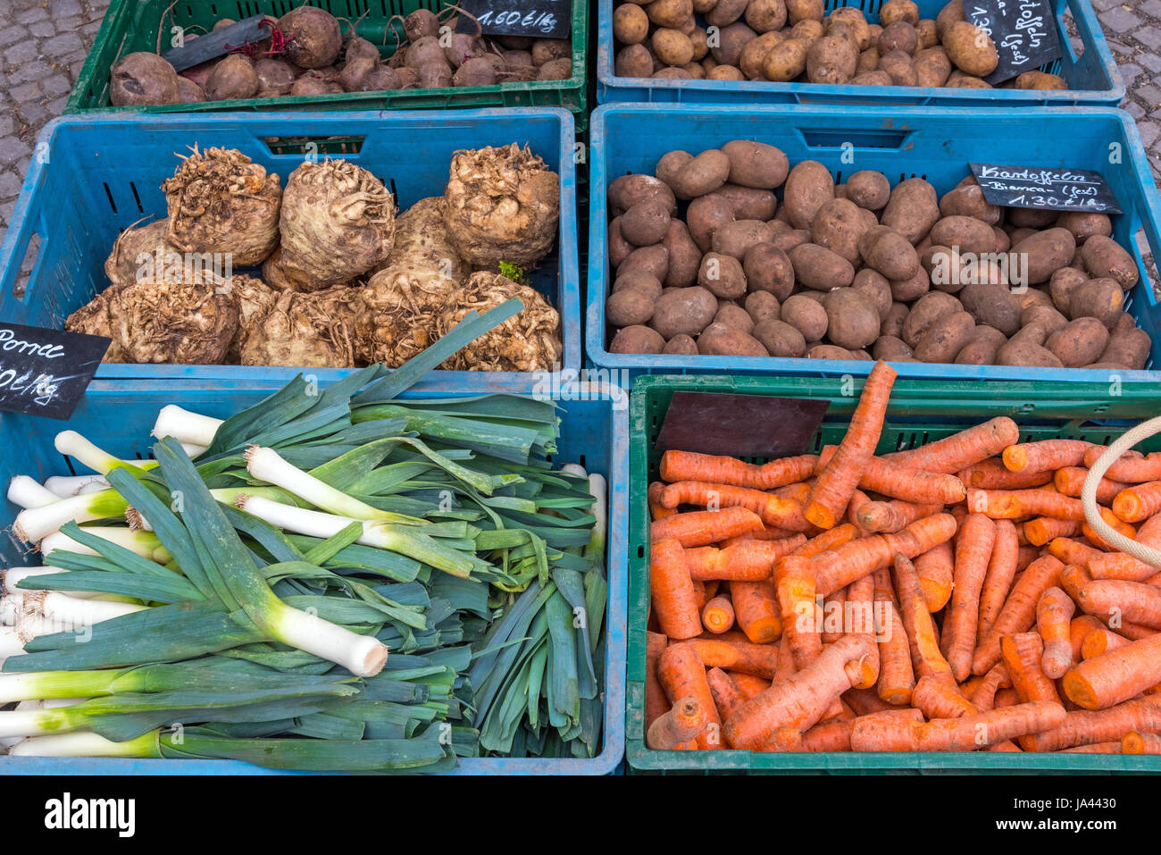 Leek, carrots and potatoes for sale at a market Stock Photo Alamy