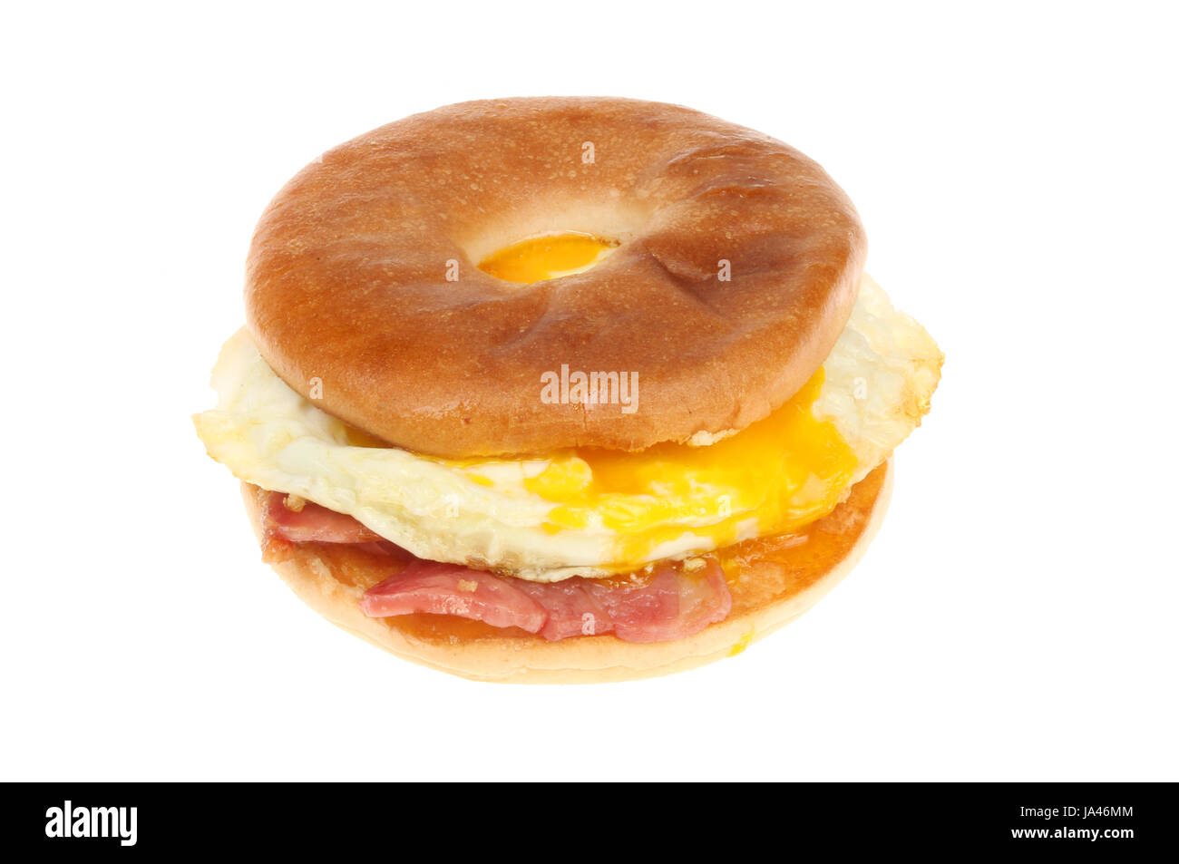 Bacon and fried egg in a toasted bagel isolated against white Stock Photo