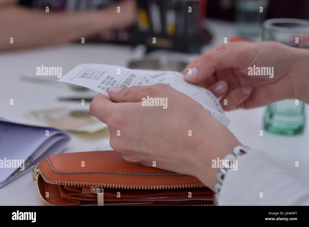 View of woman hands holding bills to pay Stock Photo