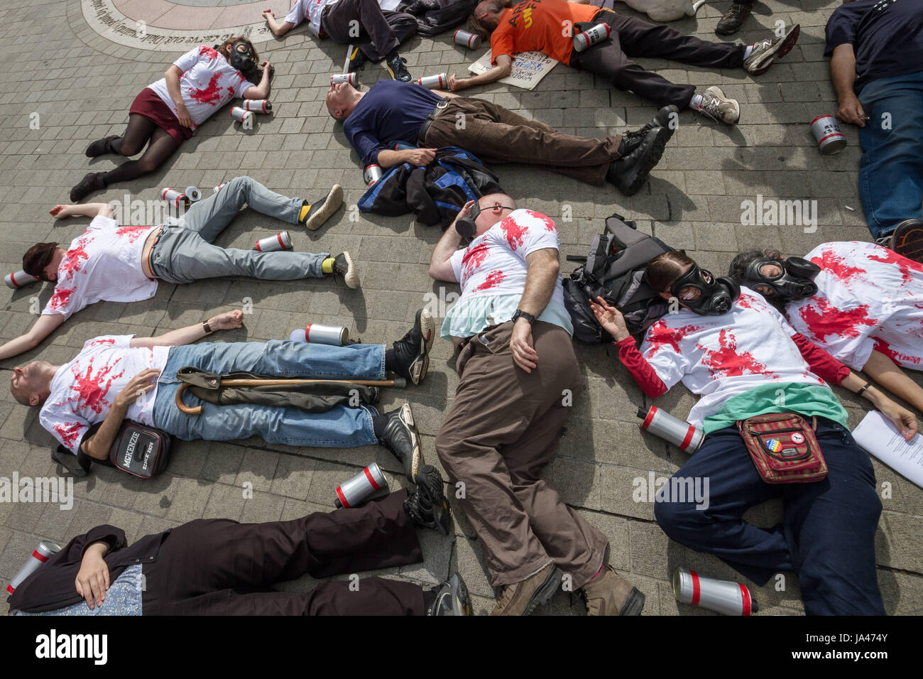 Demonstrators stage a ‘die-in’ protest. Stop the Arms Fair. Anti-war protesters outside Parliament Buildings in London, UK. Stock Photo