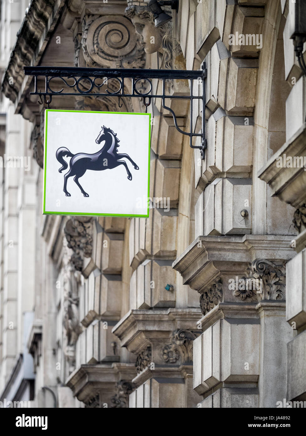 New style Lloyds Bank signs outside a branch in the City of London, London's financial district, UK. Stock Photo
