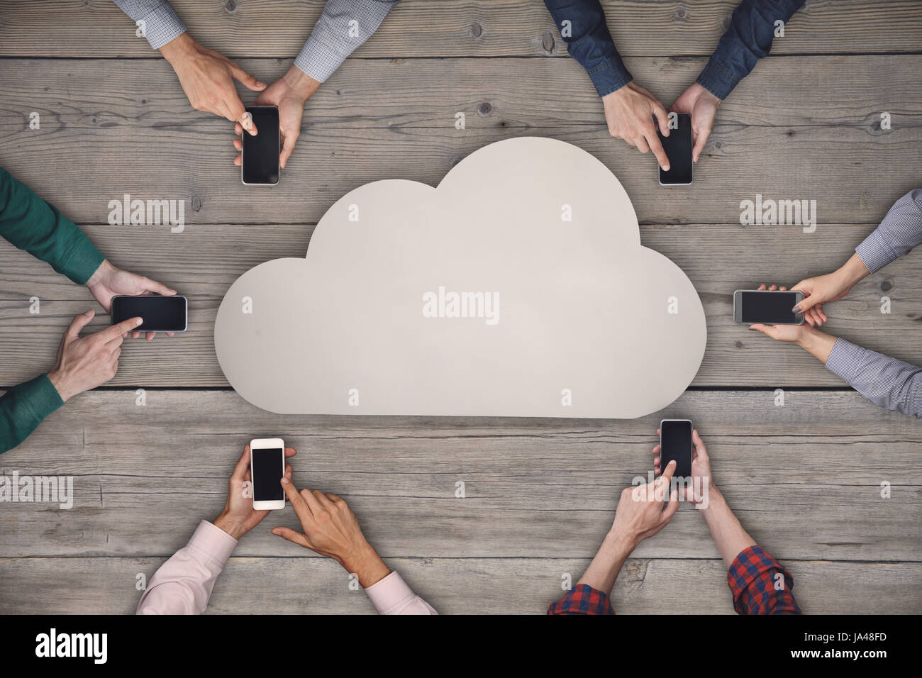 Business team working on smartphones. Cloud sharing wireless concept Stock Photo